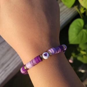 A Purple & Gold Heart Clay Bead Bracelet